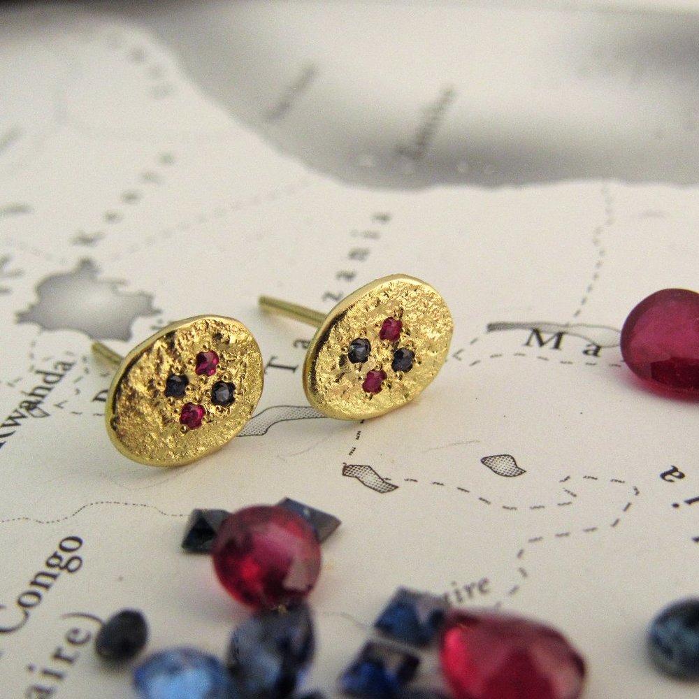 Gold earrings. Ruby and sapphire earrings.
